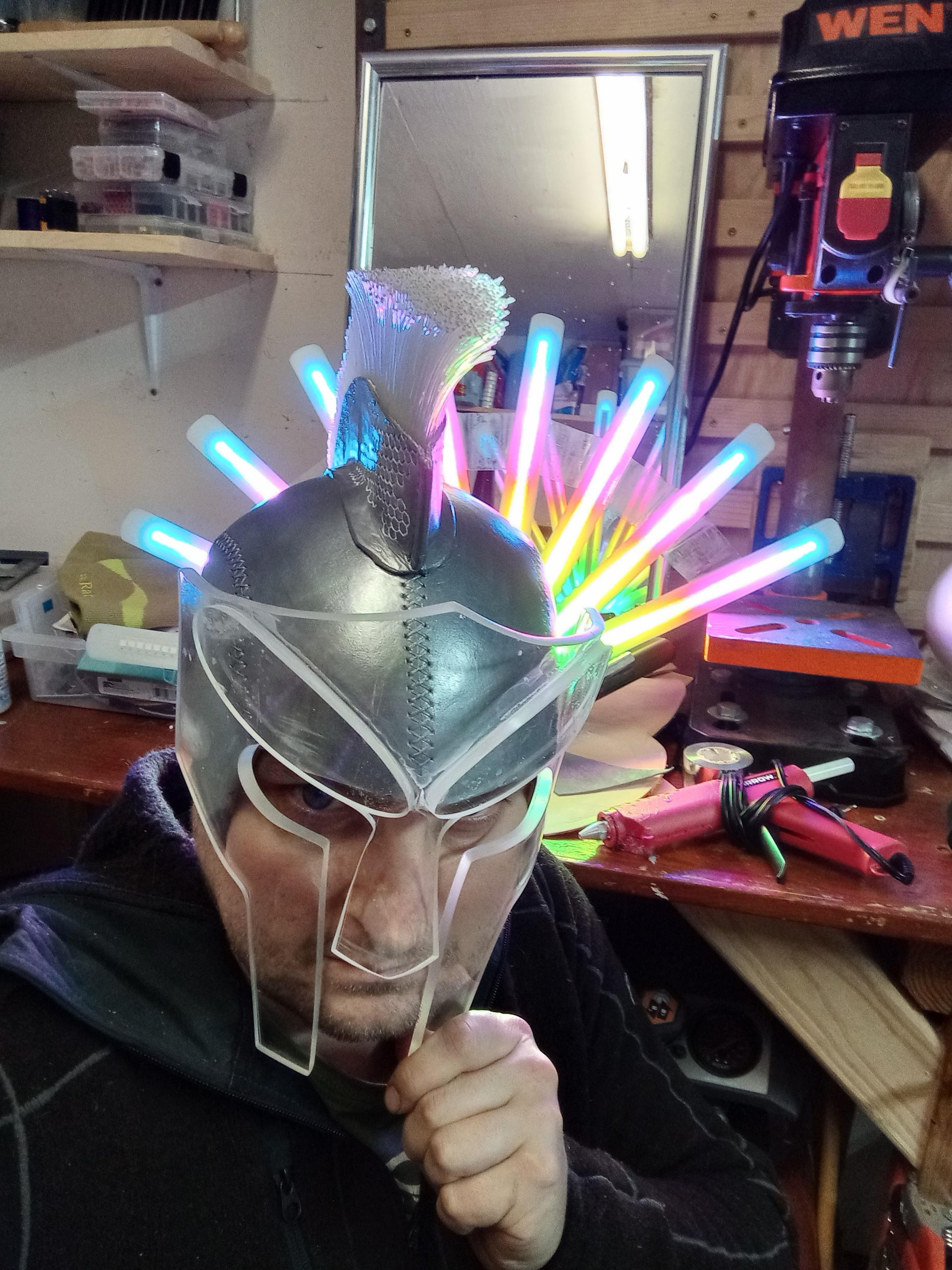 Wearing the Russell Glow helmet in the workshop, its translucent spikes lit from within.