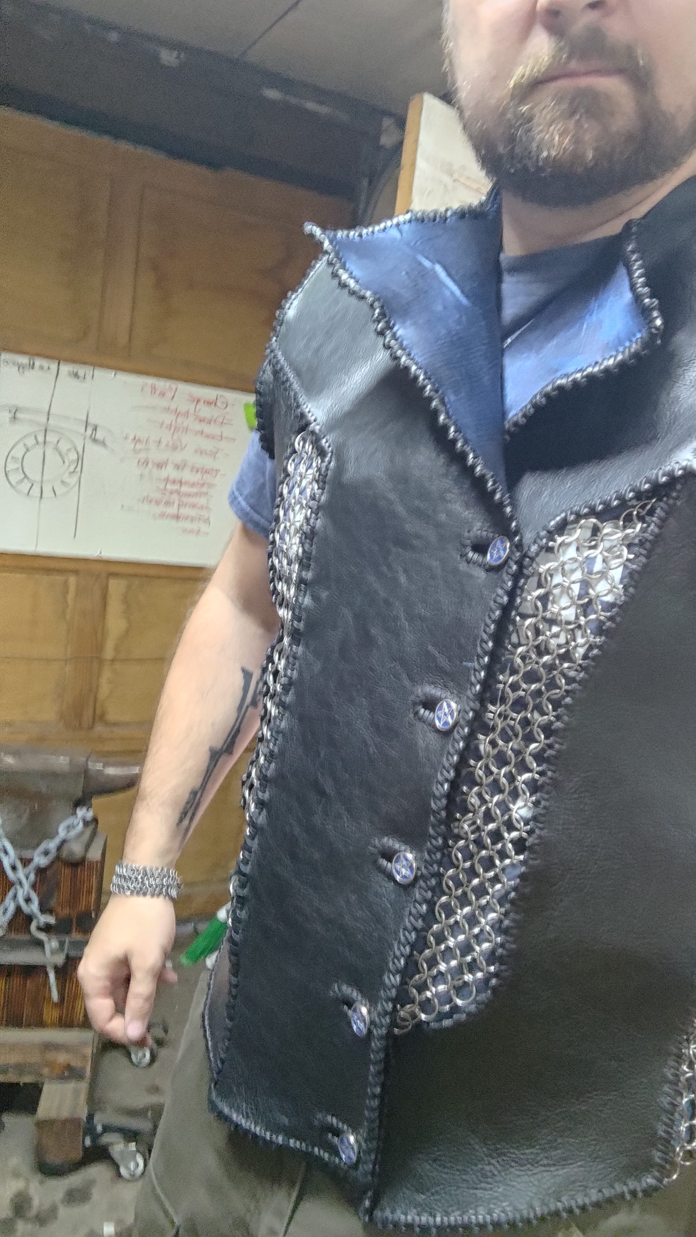 A leather and chainmaille vest worn in the workshop.