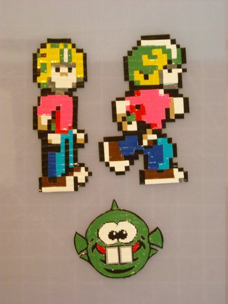 Duct tape pixel art of Commander Keen characters.