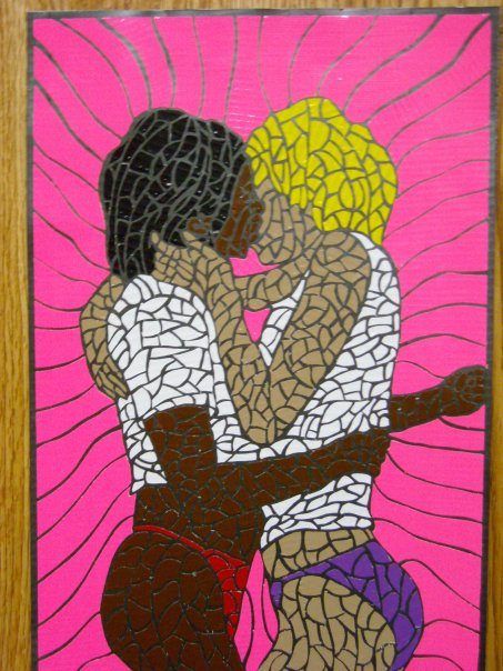 A framed duct tape mosaic of two women kissing on a pink background.