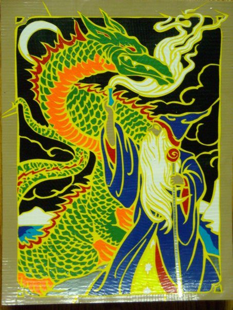 Duct tape art of a wizard facing a green dragon.