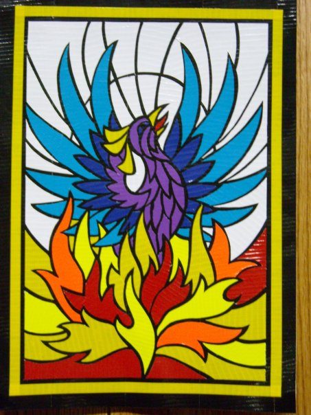 Duct tape art of a phoenix rising from flames in a stained-glass style.
